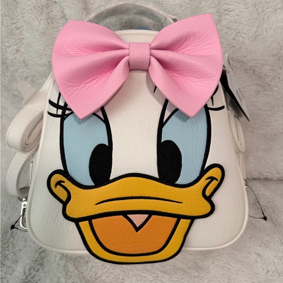 Loungefly Handbags - Reversible Donald & Daisy Loungefly backpack/crossbody.